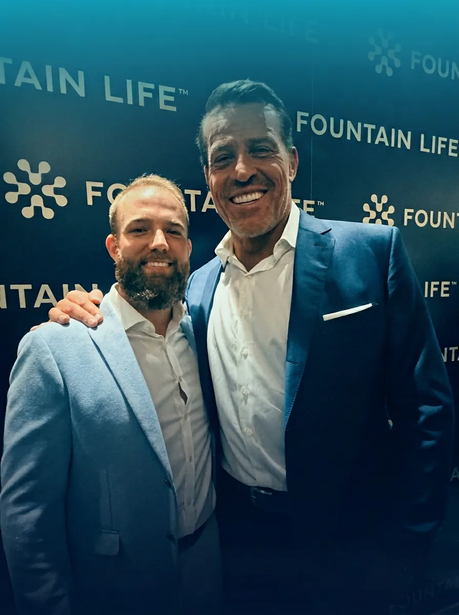 Brett Harmeling with Tony Robbins at Fountain Life — Blue Zones Spring Issue cover.